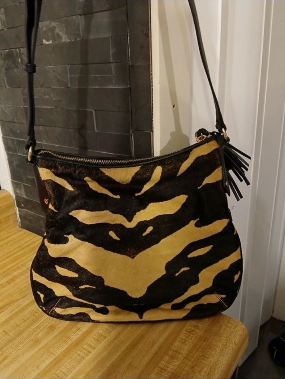 Henri Bendel- Black and Tan Animal-Print Calf Hair Shoulder Bag with Tassel - Picture 2 of 7